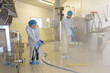 © auremar - factory worker cleaning floor with water spray