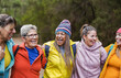 Group of multiracial women with different ages having fun together during trekking day at mountain forest