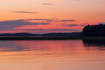 Wall Mural - natural landscape with a beautiful sunset over the wide northern lake