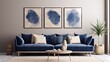 Minimally modern living room with navy blue velour sofa and beige silk pillows. Beige wall painting for art or decor. .