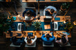 An overhead view of a busy coworking space, capturing the dynamic interaction between individuals from various industries working on laptops and sharing ideas
