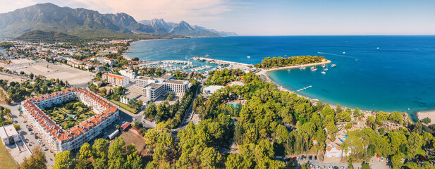 Wall Mural - the essence of Kemer resort town, Turkey's coastal charm with our breathtaking aerial image showcasing its scenic landscapes and vibrant blue waters.