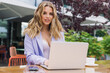 © makedonski2015 - Businesswoman is working on a laptop outside. Working breakfast on the summer terrace