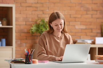 Poster - Teenage girl with laptop doing lessons at home