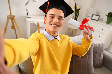 Poster - male graduate student with diploma taking selfie at home