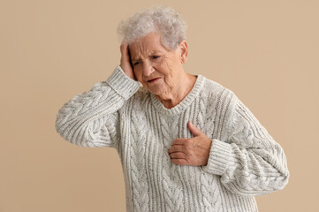 Sticker - Elderly woman having heart attack on beige background