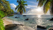 canvas print picture - Panoramic view of beautiful beach at sunset with coconut palm tree, sea and beautiful rocks, Beau Vallon beach, Mahe island, Seychelles.