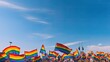 © kept - A panoramic display of LGBTQ+ pride flags waving against a clear sky during a pride parade.