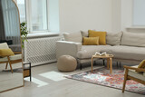Fototapeta Panele - Stylish living room with beautiful carpet and furniture. Interior design