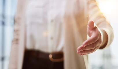 casual woman in white shirt makes a welcoming gesture