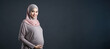 a Malay pregnant woman with copy space. Pregnancy concept.
