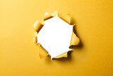 Fototapeta  - 穴の空いた黄色い紙の背景テクスチャー