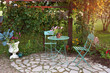 Bistro Table Set in A Summer Cottage Garden at Sunset