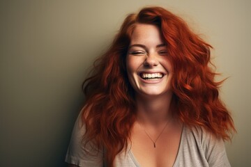 Wall Mural - Radiant Redhead: Confident and Cheerful Young Woman with a Joyful Smile in a Secluded Studio Portrait