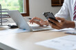 © Charlie's - Business man holding Smartphone working mobile devices. cell telephone technology e-commerce smartphone for business work