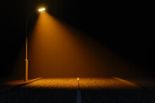 A Lone Lighting Pole On A Dark Stretch Of Road.