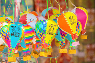 Wall Mural - Handmade souvenirs in form of colorful hot air balloon selling in gift shop in Goreme. Old film stylization. Typical souvenir or gift from Cappadocia, Turkey (Turkiye)