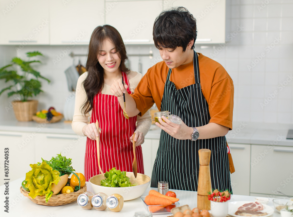 Asian young lover couple husband and wife in casual outfit with apron ...