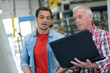 © auremar - manager holding a laptop at the factory