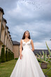© alipko - Fashion bride in wedding dress. Summer wedding