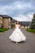 © alipko - Fashion bride in wedding dress. Summer wedding