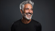 Handsome Senior Man In Black T-shirt With White Hair, Smiling, Displaying Vibrant Health With Great Tan Skin And White Teeth