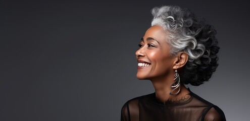 Wall Mural - Beautiful black woman with smooth healthy face skin. Gorgeous aging mature woman with long gray hair and happy smiling. Beauty and cosmetics skincare advertising concept