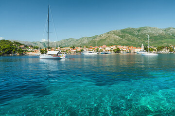 Wall Mural - Cavtat town in Dalmatia region, Croatia. Bay in Adriatic sea with yachts and boats