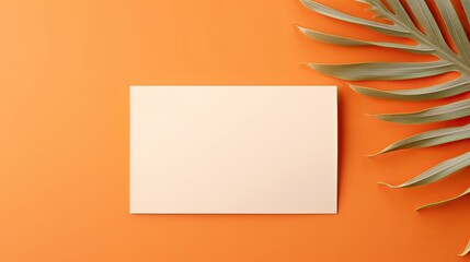 Poster - Luxurious invitation or business card template featuring dried palm leaf on an orange background . Mockup image