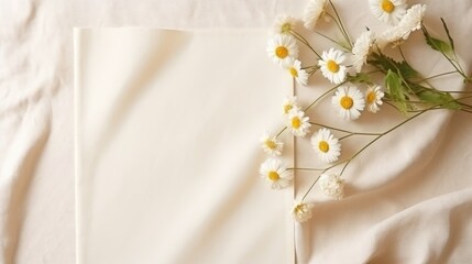 Poster - A blank wedding invitation template with chamomile buds and muslin cloth on a neutral background Minimalist and elegant. Mockup image