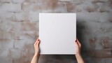 Fototapeta Nowy Jork - High quality photo of a blank white book mockup in hand on a gray banner background