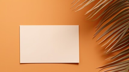 Poster - Luxurious invitation or business card template featuring dried palm leaf on an orange background. Mockup image