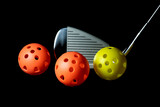 Fototapeta Dziecięca - Golf Club and Plastic Practice Golf Balls on a Black Background