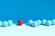 Difference and individuality. Red sphere stands out from the blue spheres.
