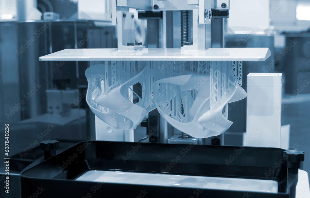 Printed models on 3D printer close-up. Objects printed on photopolymer ...