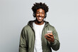 © wolfhound911 - Black man with phone on studio background. .