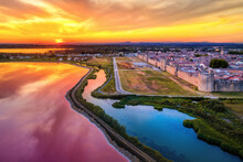 The Pink Salt Lakes And The Medieval Walled Old Town Of Aigues-Mortes, Camargue, France