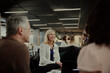 © Johnér - Group of business people having meeting in lobby