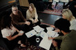 © Johnér - Group of business people having meeting in lobby