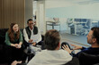 © Johnér - Group of business people having meeting in lobby