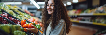 Young woman buying groceries in a supermarket