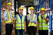 © offsuperphoto - group of workers thumbs up pose after success work in the warehouse storage