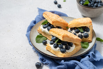 Poster - Stuffed puff cookies with whipped cream and blueberries