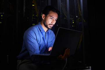 Poster - Night, server room or man typing for cybersecurity glitch, machine or internet servers system. IT support, data center or Asian engineer fixing network for information technology solution or research