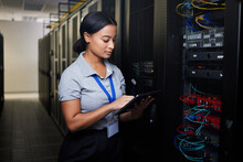 Woman, Tablet And Data Center In Inspection, Programming And Coding Of Power Solution, Cables Check Or Cybersecurity. Engineering Person On Digital Tech, Hardware And Software Network In Server Room