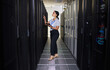 © Nina L/peopleimages.com - Tablet, woman and engineer in data center for inspection of programming hardware. Information technology, check and technician in server room, networking maintenance or code for system admin software