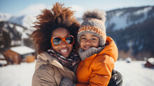 Black African American Mother With Son Smiling At A Ski Resort In Winter Clothes View Of Mountains And Snow In The Background Winter Snow Christmas Season