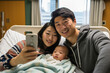 © Surachetsh - In a hospital, Asian dad and mom holds their newborn in a close-up portrait, radiating a harmonious and traditional family mood. Generative AI.