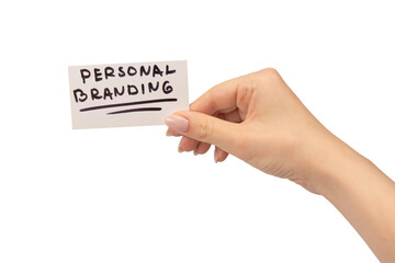 Personal branding text on a card in woman hand isolated on white background.