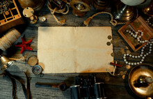 Sheet Of Paper On Rustic Wood Table With Vintage Marine Objects. Treasure Island Background. Hold Of A Ship.